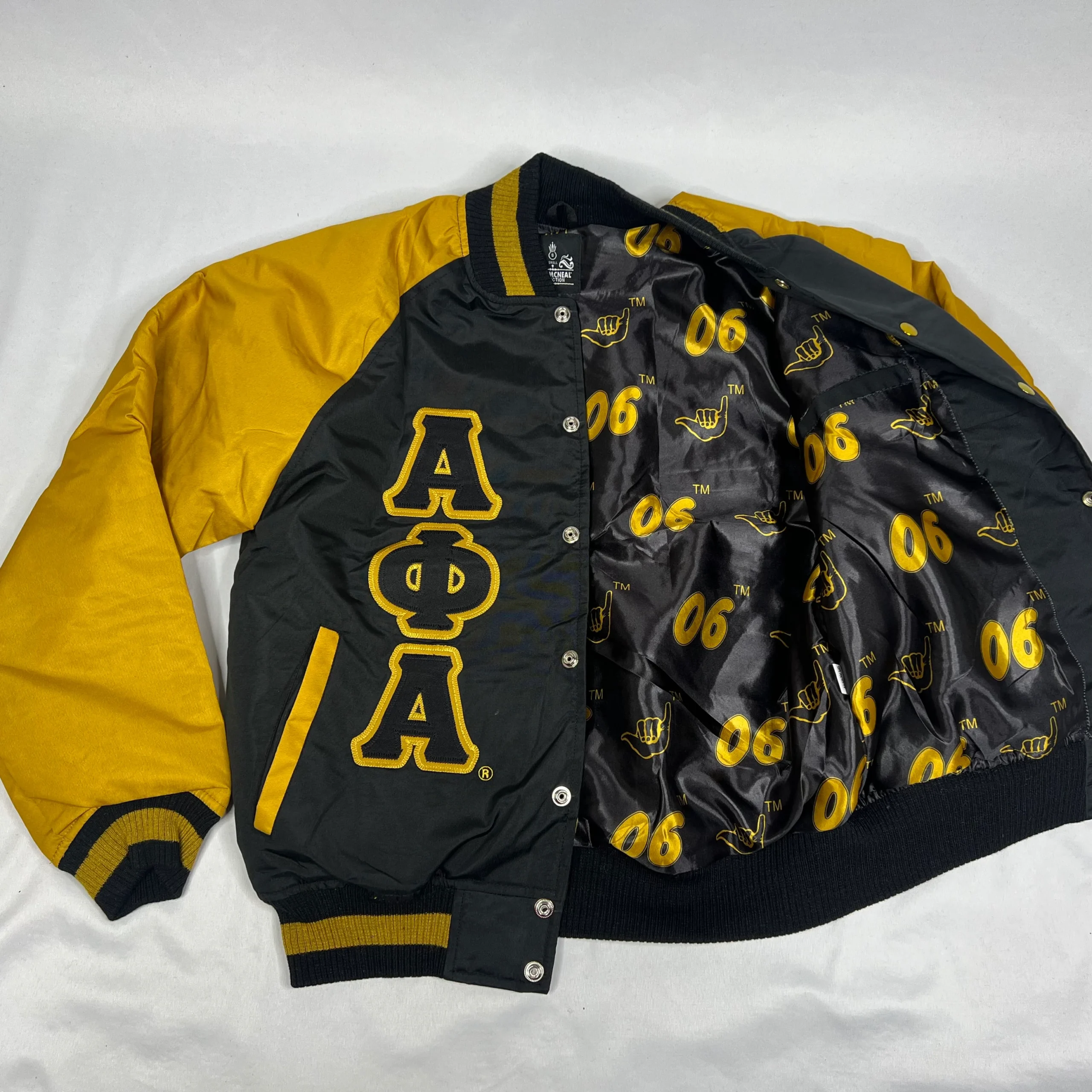 Discover the stylish Alpha Phi Alpha Bomber Jacket, perfect for showcasing your fraternity pride while staying warm and fashionable. Shop now!