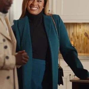 Product Specification: Inspired by Reagan Gomez-Preston from Unexpected Christmas. Made up of wool fabric and viscose inner lining. Front has open closure with lapel collar. Two pockets on the front and one inside. Full length sleeves. Available in blue color.