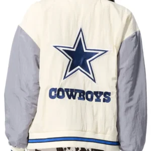 Inspired by Dallas Cowboys from National Football League. Made up of nylon fabric and viscose inner lining. Front has buttoned closure with ribbed collar. Two pockets on the front and two inside. Full length sleeves with ribbed cuffs. Available in cream and grey color. Available for both Men and Women sizes